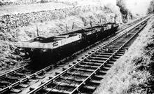Middleton Incline with a rake of four wagons supporting 60-foot rails descending.