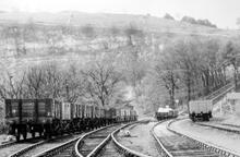 A rake of wagons standing at the entrance to Middle Peak Siding and Coal Yard May 4th 1954. (CHP1 @ 20m 79ch)