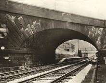 Rainhill, bridge No 71 (DSE @ 8m 67ch). Track level view of west face of bridge, with station beyond. Circa 1949 (Ref: 030605)