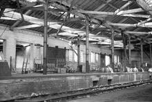 012041  Rugby Goods shed (LEC1 @ approx 82m 50ch). Interior viewed from eastern doorway. 8 August 1975 (Ref: 012041)