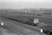 012062   Rugby Goods Yard (LEC1 @ approx 82m 50ch). Class 25/1 no. 25070 on train of empty 16 ton mineral wagons. 8 August 1975 (Ref: 012062)