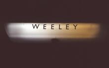Weeley station  (COC @ 62m 76ch). Illuminated platform sign / lamp. 11 April 1987 (Ref: 221488)