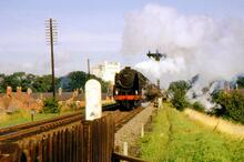 Britannia Pacific 70041 “Sir John Moore” leaving Louth (ELR @ 141m 00ch) on a southbound express. August 1962