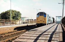Hubbert's Bridge station (GRS2 @ 133m 48ch). Class 31 No 31244 hauling freight train. 24 September 1980