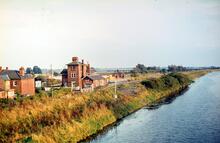 Woodhall Junction station (LNL2 @ 122m 65ch) alongside the River Witham. 22 September 1980
