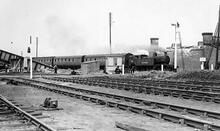C12 Class 4-4-2T No.4549. Hauling a train on the Withernsea Branch on 28 July 1943 past the remains of Southcoates Lane Bridge destroyed by enemy bombing eight days earlier. (Ref: 030823)