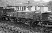 Crianlarich Upper (WHL @ 36m 23ch). Station building and  LMS 13T medium open ZAV DM478325. 19 May 1979