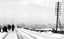Benton Station approach from South West. (BTN @ 4m 21ch). Workmen clearing the track and repairing damage caused by the snowstorm of February 1941. (Ref: 031280)