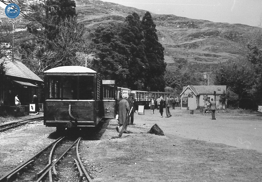  Ffestiniog Railway. Tan-y-Bwlch (RFF @ 7m 35ch). Train at station with observation car no 100 at rear. No locomotive