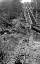 Llyn Cowlyd Tramway. Part way up the incline, where the railway and pipelines are parallel. 08 December 1963