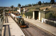 Beer Heights Light Railway, Devon. Train hauled by Thomas II, at Much Natter station. 27 July 1984