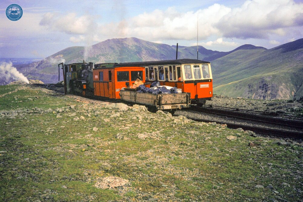 Three trains at Clogwyn (3m 29ch). No.  7 with a Down goods, passing No. 5 (up). No 3 has just left. 05 August 1989