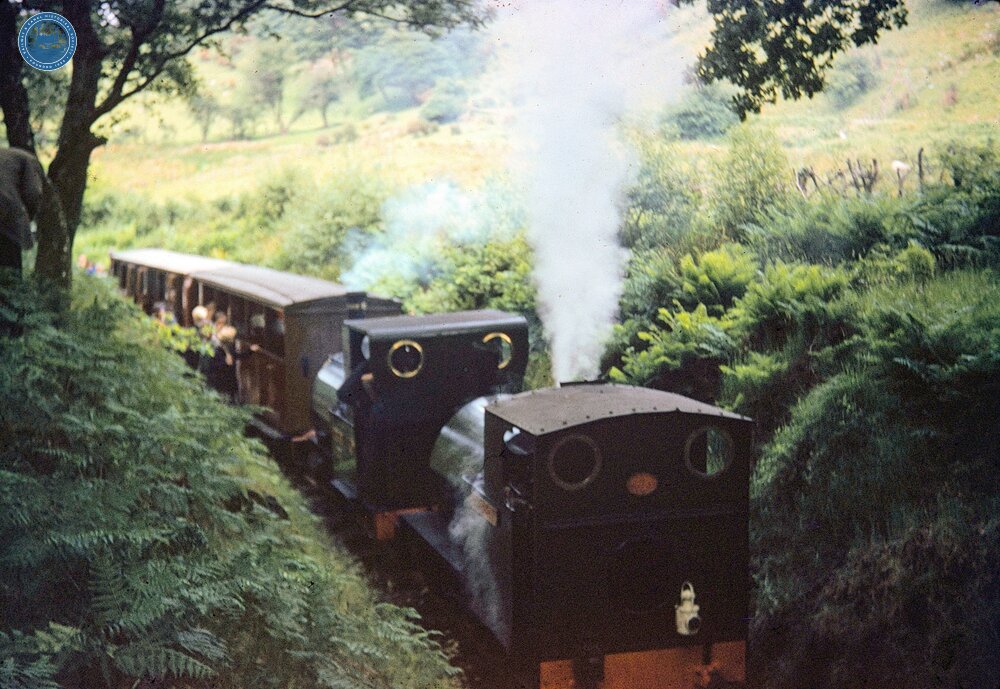 Dolgoch. TRPS Special on the return journey. Locomotives Nos 1 and 4 taking water. 31 May 1959. 