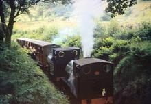 Dolgoch. TRPS Special on the return journey. Locomotives Nos 1 and 4 taking water. 31 May 1959. 