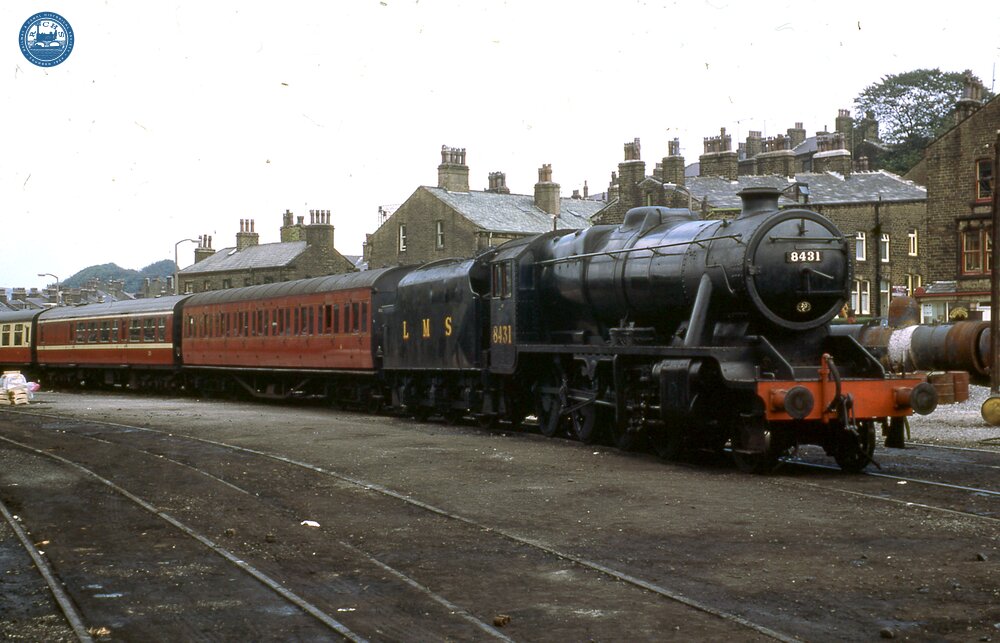 017095   LMS steam loco  class 8F 2-8-0 on passenger train. Howarth 6 September 1975
