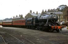 017095   LMS steam loco  class 8F 2-8-0 on passenger train. Howarth 6 September 1975