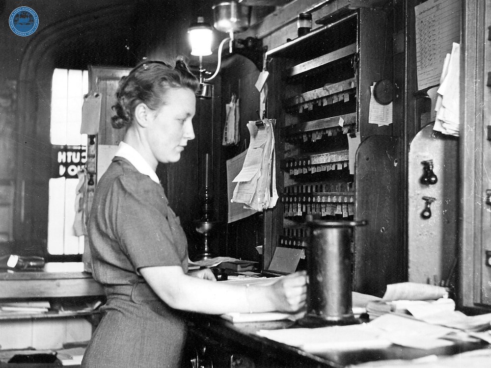 A woman ticket clerk a 1940s wartime recruit in an unidentified ticket office. (Ref: 030728)