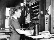 A woman ticket clerk a 1940s wartime recruit in an unidentified ticket office. (Ref: 030728)