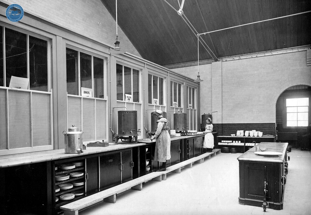 LNWR Crewe. Serving counters and staff preparing for service in workmen's canteen 19 July 1918. (Ref: 030797)
