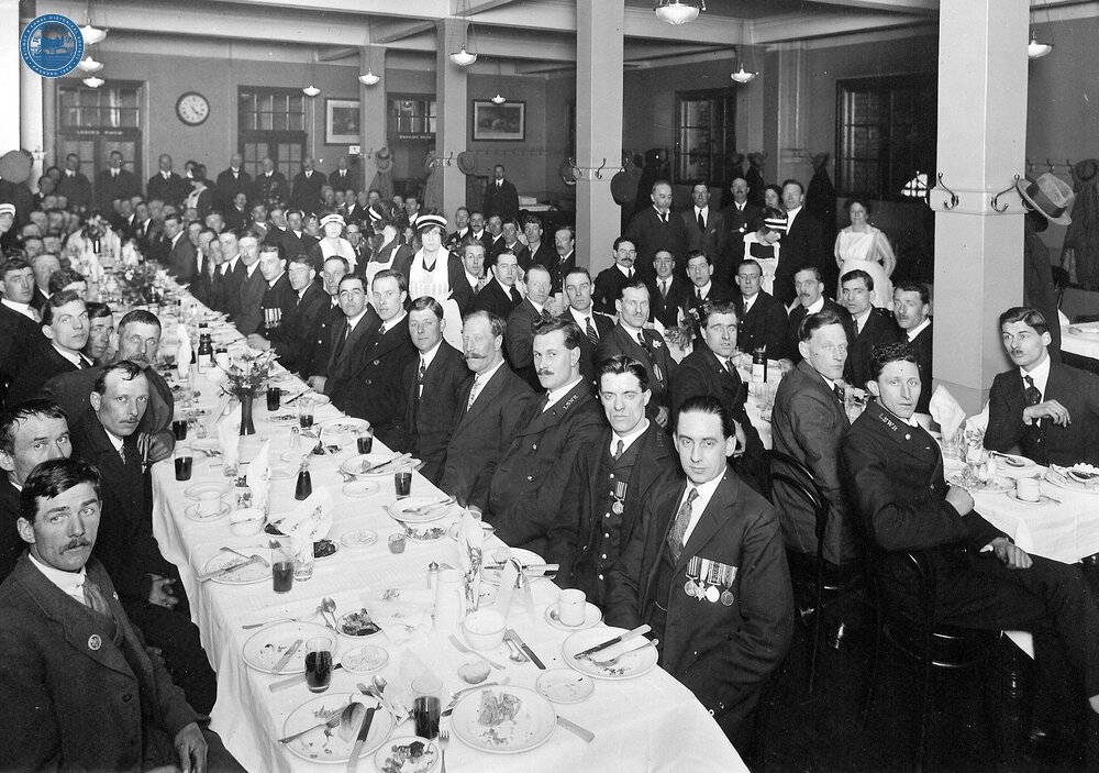 An assembly of LSWR staff enjoying a meal after the opening of the new Waterloo station - 1922. (Ref: 030992)