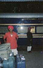 325036E  Ind_74 porter The Gujarat narrow gauge (3ft 6in) train, the Royal Orient Express at Udaipur, 6 November 2000.