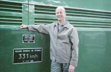 Ian Bradley beside SNCF world speed record electric locomotive BB9004 at Paris Bercy station. 2002