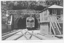 017330 Train leaving Crystal Palace tunnel (BBJ @ 8m 60ch) (signal box in foreground) Fromt of train of Crystal Palace stock leaving tunnel.Photograph LB&SCR. 