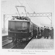 017315 First electric train at East Brixton Station (ATL @ 5m 8ch) - LB&SC Railway. South London stock with senior staff and dignitaries on th eplatform. 017315E  E_65Photograph - 