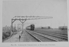 017603  Cantilever construction at Poupart's Junction train approaching (VTB @ c2m). Photograph LB&SCR