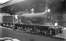 K10 Class 4-4-0, number 389, built 1902 Nine Elms, withdrawn 1951. Driver obscures number on cabside, but *89 is evident on the buffer beam..(Ref: 011881E ButRob7 )