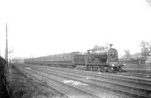 Possible L11 class (or K10) 4-4-0 on passenger train. Number not recorded ,. (Ref: 011884E  ButRob11  )