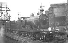 L12 Class number 419 4-4-0 at the of a passenger train at Waterloo. . (Ref: 011886E ButRob13)