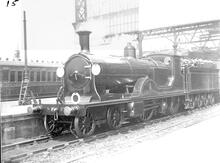 E10 Class 4-2-2-0 number 371 double single steam locomotive at platform. Built 1901, withdrawn 1926.(Ref: 011888E BW15)