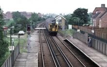 EMU 1572 heads the 12.32 Ramsgate - London Charing Cross into Sandwich (BME2 @ 86m 46ch). 21 June 1986