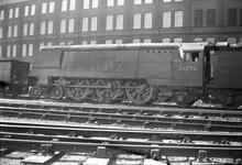 011948E S(SLN)284 Stewarts Lane 34070 Manston BR,BRS, steam loco Battle of Britain class 4-6-2 no 34070 Manston. Stewarts  Lane shed 1956.. Engine plus part tender