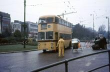Bournemouth Corporation trolleybus, Reg. No. YLJ286 passing Corporation flagman at The Square near Richmond Hill. 30 March 1968 (ref. 260075)