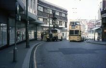 Bournemouth Corporation trolleybus passing tower wagon in Old Christchurch Road. 21 Apr 1968