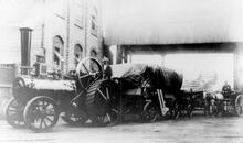  A Traction Engine (possibly by Wallis & Steevens) towing a thresher